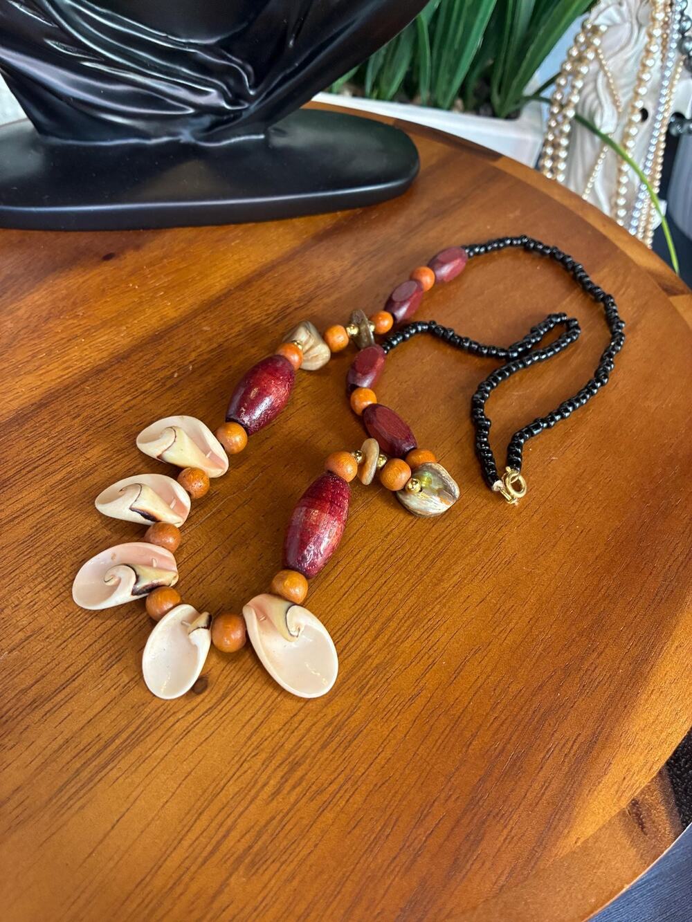 Seashell and wood beaded statement necklace. Boho chic.